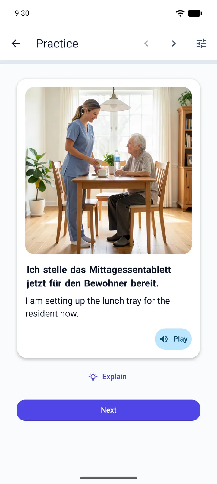 The Viglot Practice screen with the app interface in English: a B1 German scenario card showing a carer in scrubs setting a cup down in front of a smiling elderly resident in a care-home dining room, with the German sentence “Ich stelle das Mittagessentablett jetzt für den Bewohner bereit.” and its English translation